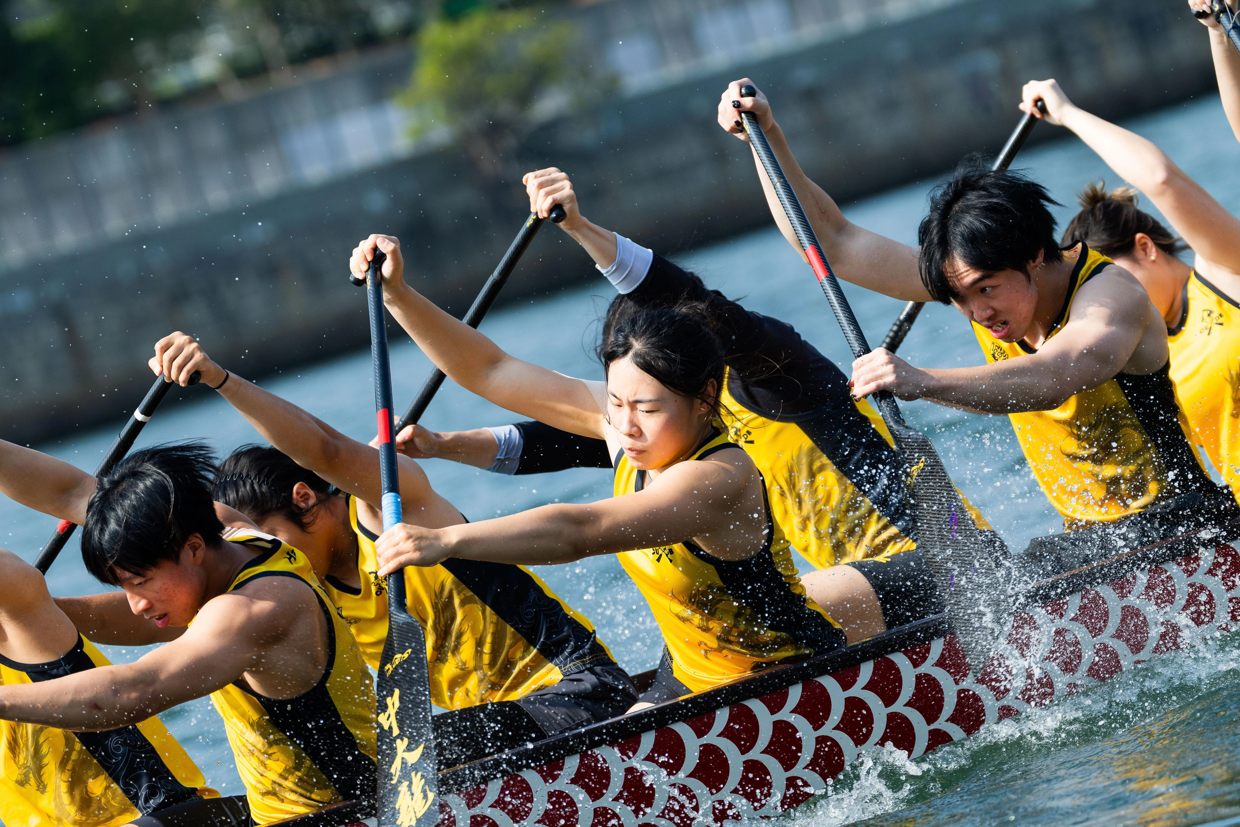 CUHK students rowing a dragon boat